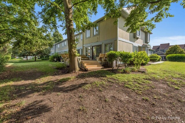 372 Goshawk Ln, Deerfield, IL 60015 - back of property with a wooden deck and a lawn
