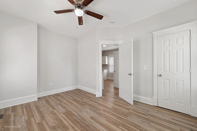 2028 S 5th Ave, Maywood, IL 60153 - unfurnished bedroom with light wood-style floors and ceiling fan