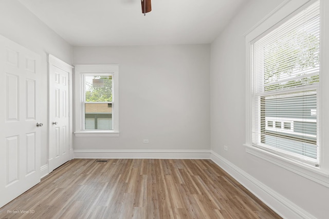 2028 S 5th Ave, Maywood, IL 60153 - unfurnished bedroom with light wood-style flooring and a ceiling fan