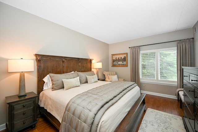 875 E 22nd St Unit 220, Lombard, IL 60148 - bedroom featuring dark wood finished floors and baseboards