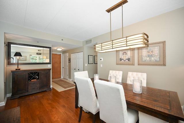 875 E 22nd St Unit 220, Lombard, IL 60148 - dining room featuring dark wood-style floors and baseboards