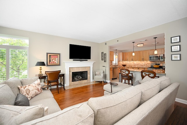 875 E 22nd St Unit 220, Lombard, IL 60148 - living room featuring dark wood-style flooring and a tiled fireplace