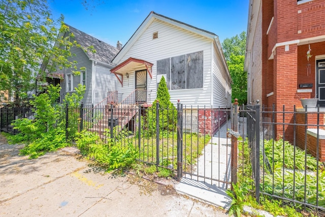 view of front of house with a gate and a fenced front yard