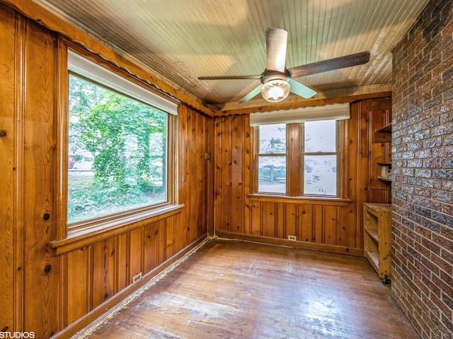 11933 S 70th Ave, Palos Heights, IL 60463 - spare room with wood-type flooring, healthy amount of natural light, ceiling fan, brick wall, and wooden ceiling