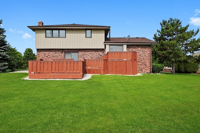 14023 S Split Rail Dr, Homer Glen, IL 60491 - back of house featuring brick siding, a chimney, and a yard