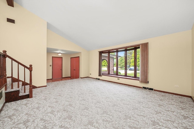 14023 S Split Rail Dr, Homer Glen, IL 60491 - unfurnished living room featuring carpet flooring, stairs, and high vaulted ceiling