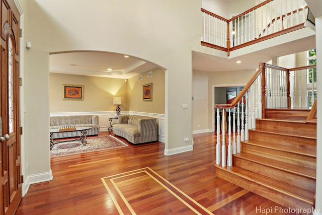 1400 Banbury Rd, Inverness, IL 60067 - entryway with arched walkways, wood finished floors, stairway, recessed lighting, and a high ceiling