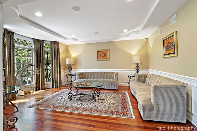 1400 Banbury Rd, Inverness, IL 60067 - living area featuring a raised ceiling, wood finished floors, recessed lighting, a wainscoted wall, and a decorative wall