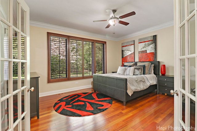 1400 Banbury Rd, Inverness, IL 60067 - bedroom with french doors, multiple windows, crown molding, wood finished floors, and baseboards