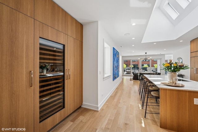 226 S Green St Unit 4N, Chicago, IL 60607 - indoor wet bar with light wood-type flooring, recessed lighting, and wine cooler