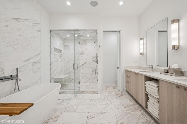 226 S Green St Unit 4N, Chicago, IL 60607 - bathroom with a freestanding tub, a marble finish shower, marble look tiles, double vanity, and recessed lighting