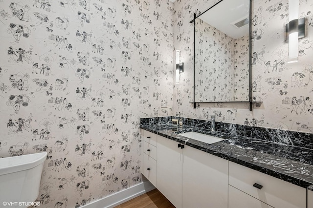 226 S Green St Unit 4N, Chicago, IL 60607 - bathroom with wallpapered walls, wood finished floors, and vanity