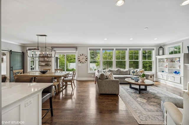 1406 Meadow Ln, Glenview, IL 60025 - living area featuring a barn door, ornamental molding, healthy amount of natural light, dark wood-style floors, and recessed lighting