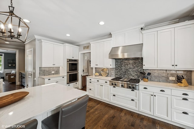 1406 Meadow Ln, Glenview, IL 60025 - kitchen with range hood, stainless steel appliances, crown molding, a chandelier, and white cabinets