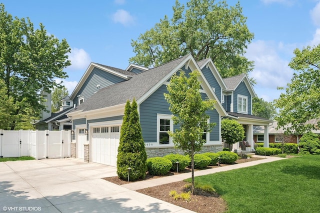 1406 Meadow Ln, Glenview, IL 60025 - view of front of house with a gate, driveway, an attached garage, stone siding, and roof with shingles