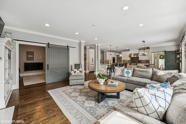 1406 Meadow Ln, Glenview, IL 60025 - living room featuring a barn door, ornamental molding, recessed lighting, and dark wood finished floors