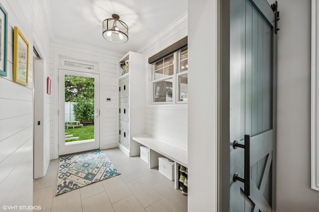 1406 Meadow Ln, Glenview, IL 60025 - mudroom featuring crown molding, light tile patterned flooring, and wooden walls