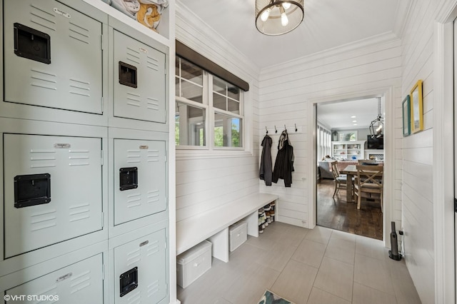 1406 Meadow Ln, Glenview, IL 60025 - mudroom with ornamental molding, plenty of natural light, wooden walls, and light tile patterned flooring