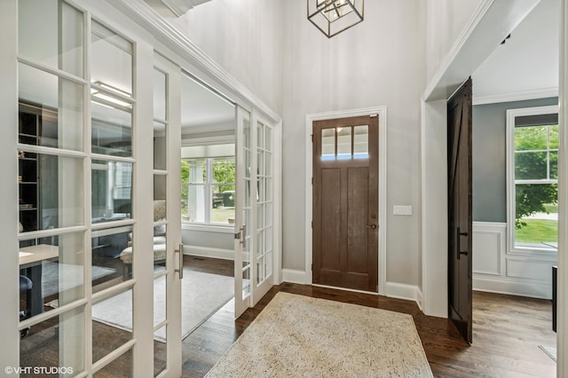 1406 Meadow Ln, Glenview, IL 60025 - entryway with french doors, dark wood-style flooring, and crown molding
