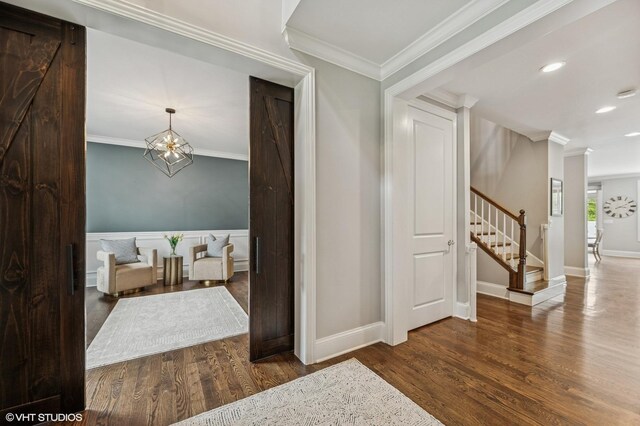 1406 Meadow Ln, Glenview, IL 60025 - corridor with wood finished floors, stairway, ornamental molding, recessed lighting, and a chandelier