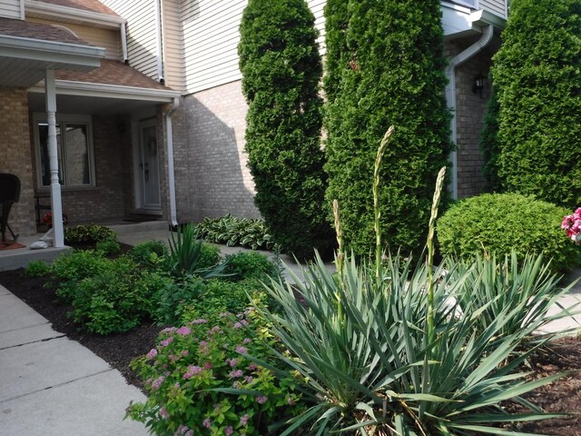 view of side of home featuring brick siding