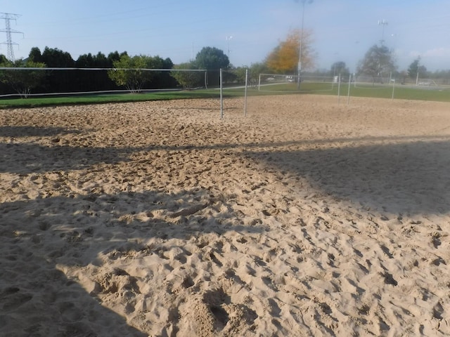 view of property's community featuring volleyball court