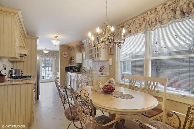 1858 Habberton Ave, Park Ridge, IL 60068 - dining room featuring a chandelier and light tile patterned floors