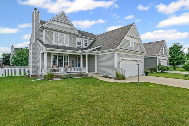 3905 Boulder Ridge Dr, Champaign, IL 61822 - view of front of home with a porch, driveway, a chimney, and roof with shingles