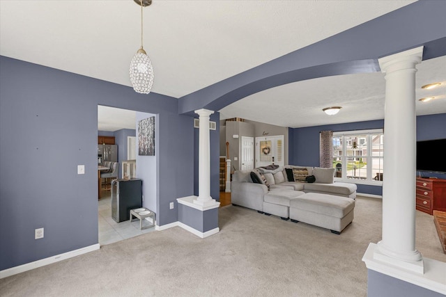 3905 Boulder Ridge Dr, Champaign, IL 61822 - carpeted living area featuring decorative columns and arched walkways