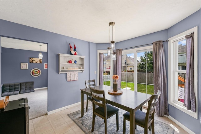 3905 Boulder Ridge Dr, Champaign, IL 61822 - dining room featuring light tile patterned floors and light carpet