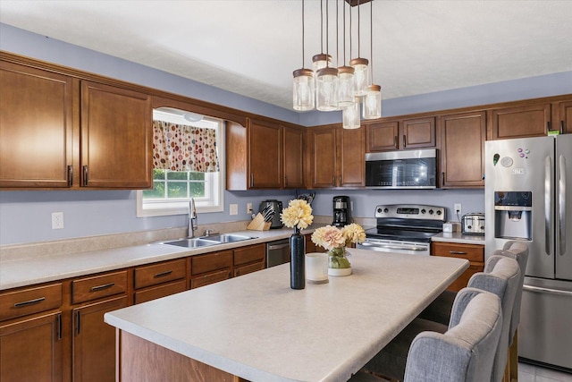 3905 Boulder Ridge Dr, Champaign, IL 61822 - kitchen with stainless steel appliances, a kitchen breakfast bar, a kitchen island, and light countertops