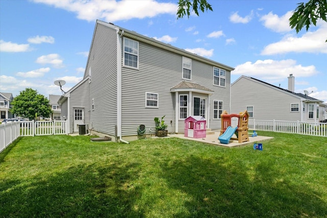 3905 Boulder Ridge Dr, Champaign, IL 61822 - back of house with a fenced backyard and a patio area