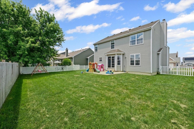 3905 Boulder Ridge Dr, Champaign, IL 61822 - back of house featuring a playground, a chimney, a patio, and a fenced backyard