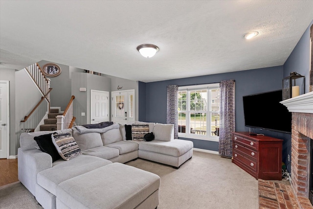 3905 Boulder Ridge Dr, Champaign, IL 61822 - living room featuring stairs, a textured ceiling, a fireplace, and carpet floors