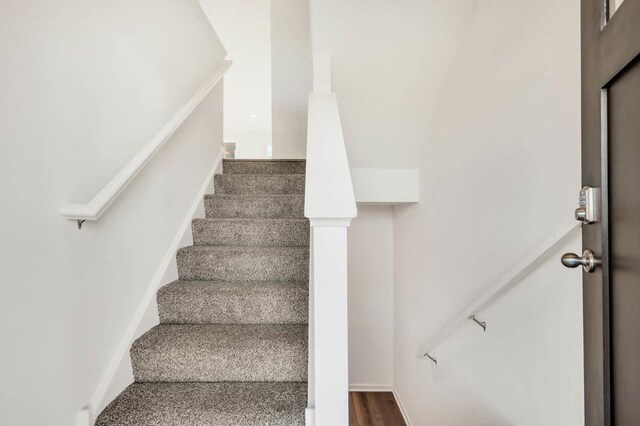 877 Briar Glen Ct, Hampshire, IL 60140 - stairs featuring wood finished floors and baseboards