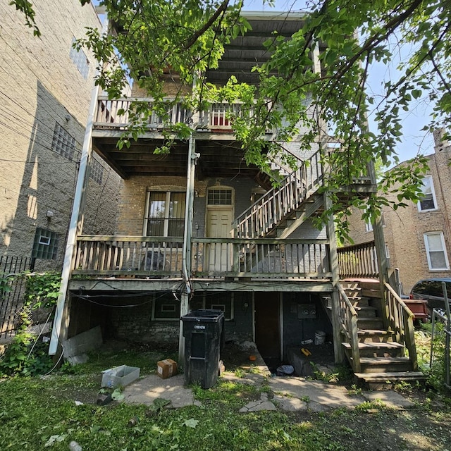 3931 W Lexington St, Chicago, IL 60624 - rear view of house with stairs, a deck, and brick siding