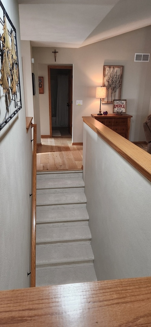 6638 Key Largo Dr, Machesney Park, IL 61103 - stairway featuring wood finished floors and baseboards