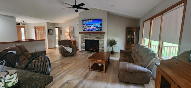 6638 Key Largo Dr, Machesney Park, IL 61103 - living room with light wood-type flooring, a ceiling fan, a fireplace, high vaulted ceiling, and baseboards