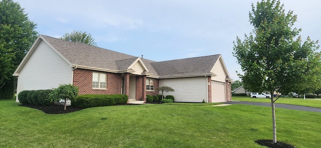 6638 Key Largo Dr, Machesney Park, IL 61103 - view of front of property with a garage, brick siding, and a front lawn