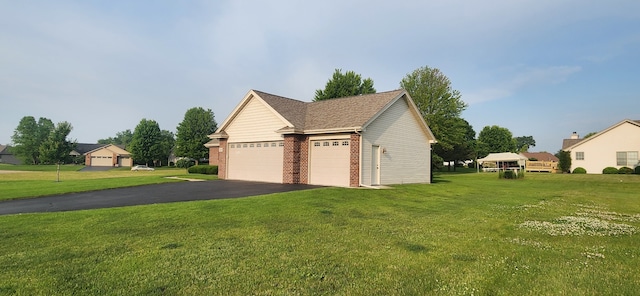 6638 Key Largo Dr, Machesney Park, IL 61103 - view of property exterior with brick siding, a yard, and a garage
