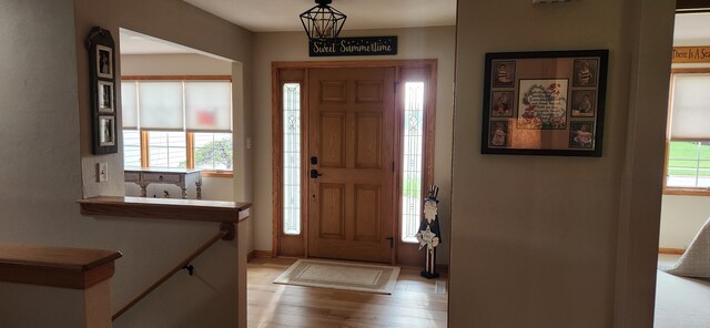 6638 Key Largo Dr, Machesney Park, IL 61103 - foyer entrance with light wood-style flooring and baseboards