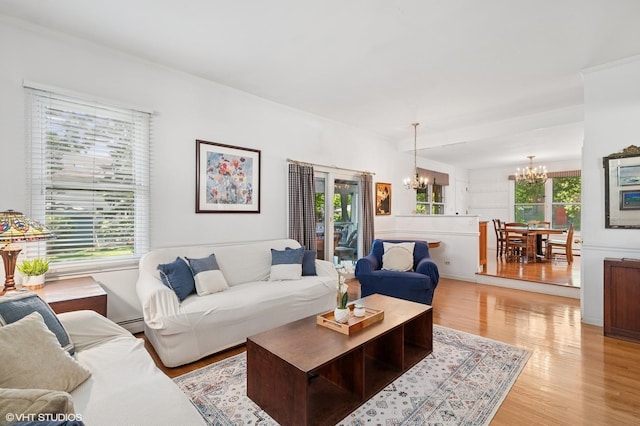 1241 Forest Ave, Wilmette, IL 60091 - living area with a chandelier, healthy amount of natural light, light wood-style flooring, and baseboard heating