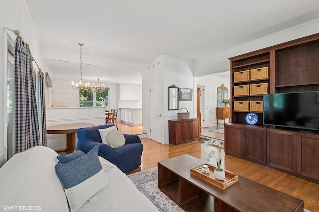1241 Forest Ave, Wilmette, IL 60091 - living area featuring a chandelier and light wood-type flooring