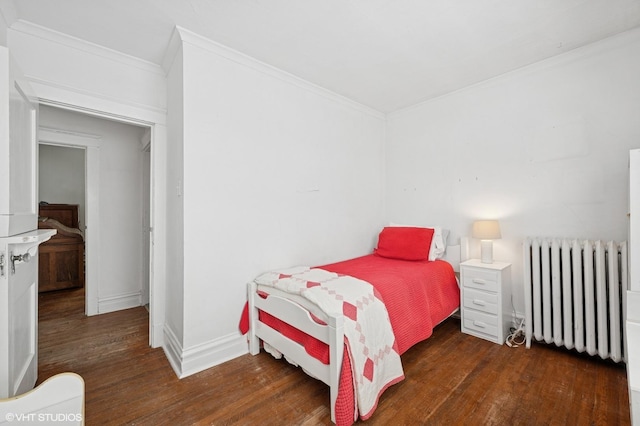 1241 Forest Ave, Wilmette, IL 60091 - bedroom featuring radiator heating unit, wood finished floors, and crown molding