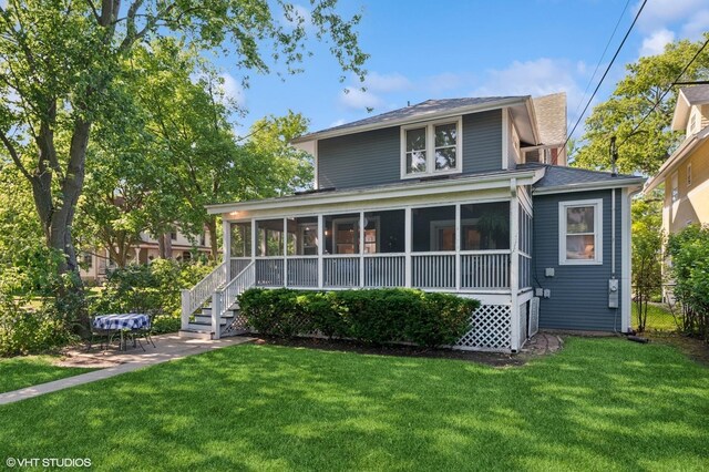 1241 Forest Ave, Wilmette, IL 60091 - rear view of property featuring a sunroom, a yard, a shingled roof, and a patio area
