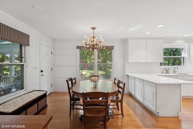 1241 Forest Ave, Wilmette, IL 60091 - dining room with a chandelier, light wood finished floors, crown molding, and recessed lighting