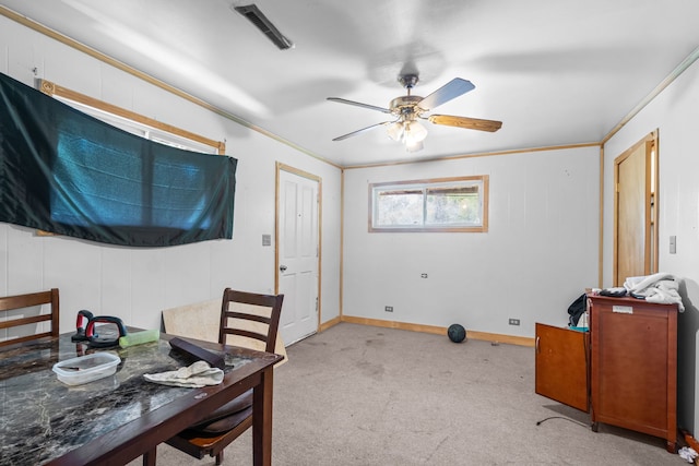 14217 Turner Ave, Robbins, IL 60472 - dining area with light carpet, a ceiling fan, ornamental molding, and baseboards