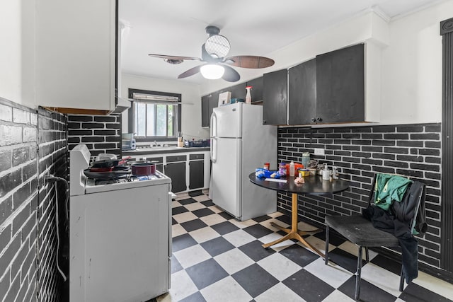 14217 Turner Ave, Robbins, IL 60472 - kitchen with white appliances, light flooring, ceiling fan, a sink, and backsplash