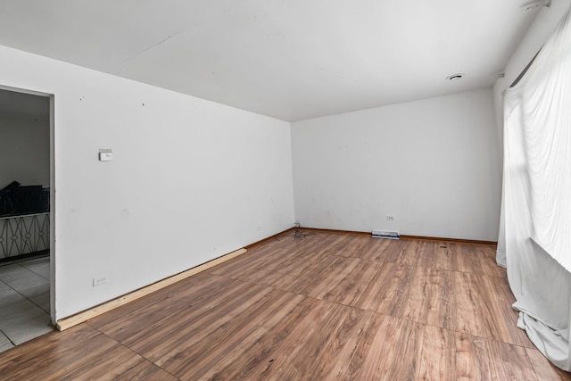 14217 Turner Ave, Robbins, IL 60472 - unfurnished room with wood finished floors and baseboards