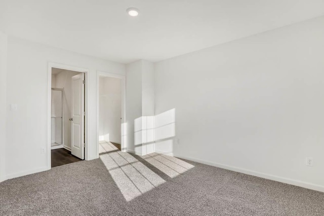 879 Briar Glen Ct, Hampshire, IL 60140 - empty room featuring dark colored carpet and recessed lighting